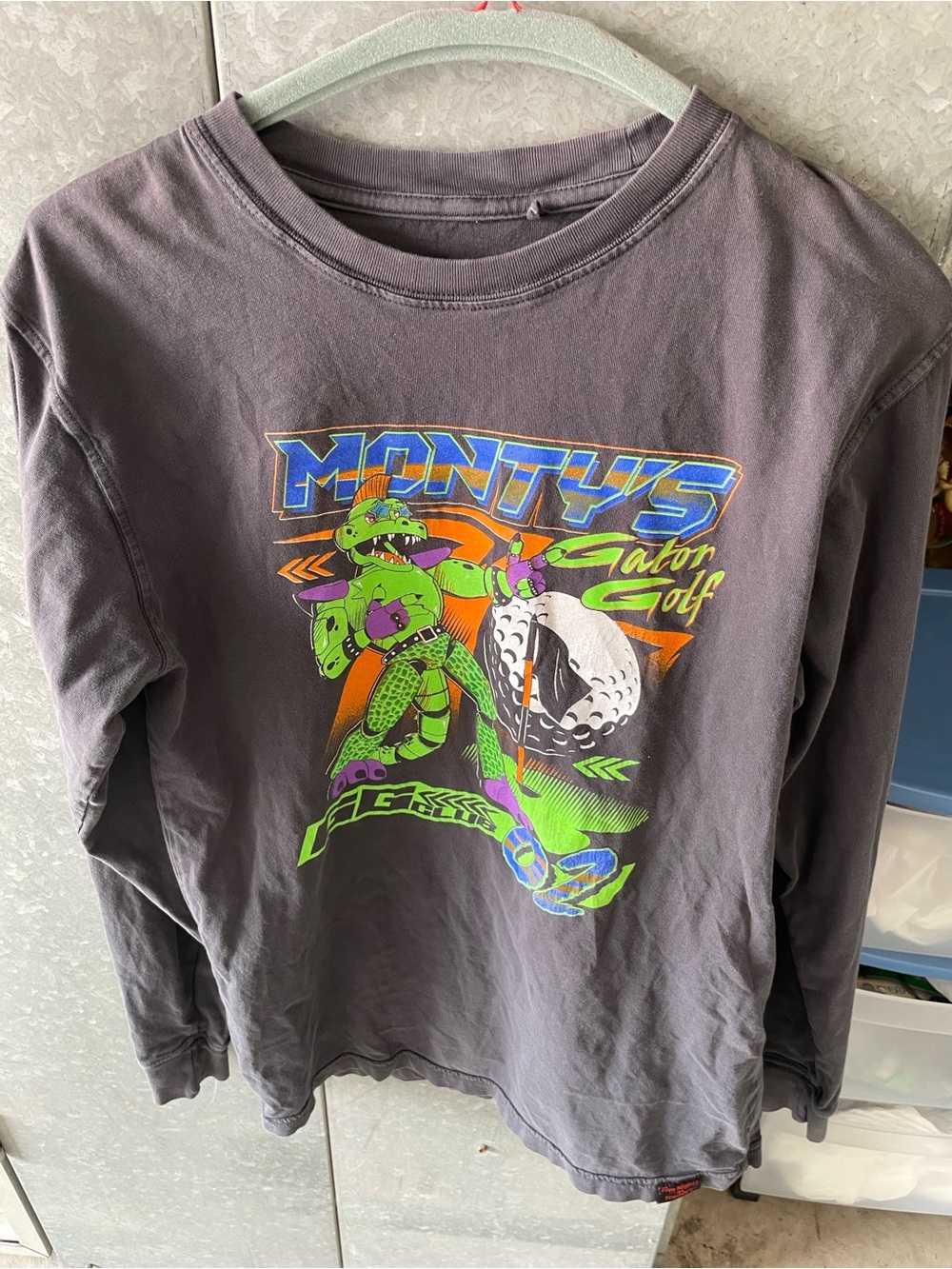 official Five Nights at Freddy’s Monty’s Gator Golf Long Sleeve Graphic T-Shirt.